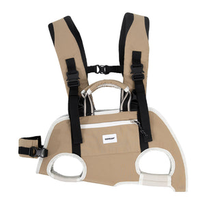 Small Dog Backpack Carrier in camel beige with individual leg openings and dual-shoulder carry for travel days.