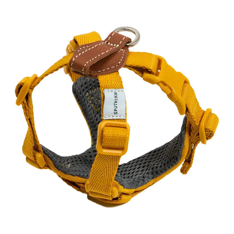 Adjustable dog harness in yellow with a choke free X-fit design, soft mesh padding, and leather back detail.
