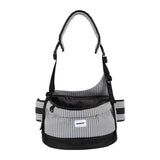Pet hip seat carrier in mist gray with an open-top seat and adjustable shoulder strap for daily adventures.