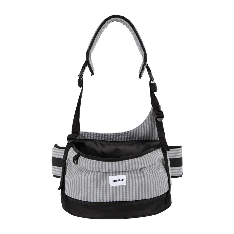 Pet hip seat carrier in mist gray with an open-top seat and adjustable shoulder strap for daily adventures.