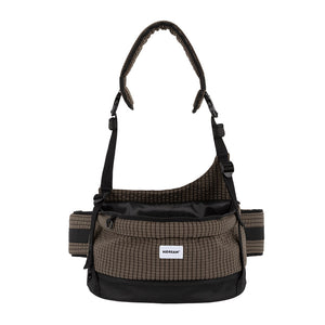 Checkered pet hip seat bag in deep mocha with a wide open seat, padded strap, and hands-free crossbody styling.