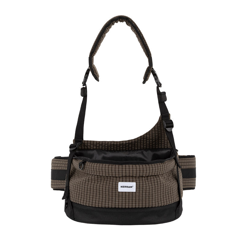 Checkered pet hip seat bag in deep mocha with a wide open seat, padded strap, and hands-free crossbody styling.