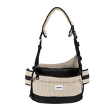 Pet hip seat carrier in vanilla beige with a padded crossbody strap and wide waist belt for everyday outings.